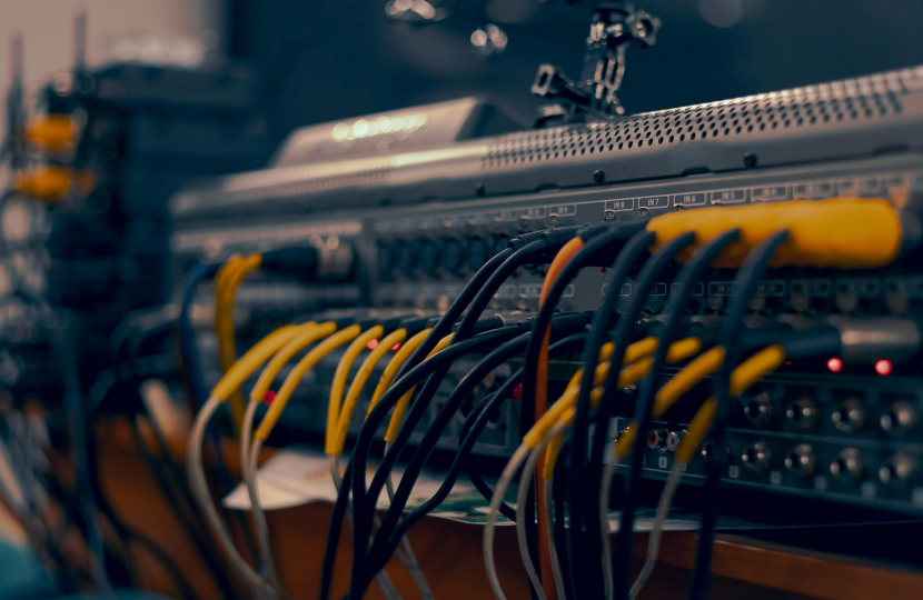 A close up of a computer with wires and cables